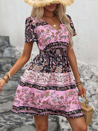 boho summer mini dress in pink and black floral design with short sleeves, perfect for casual outings.