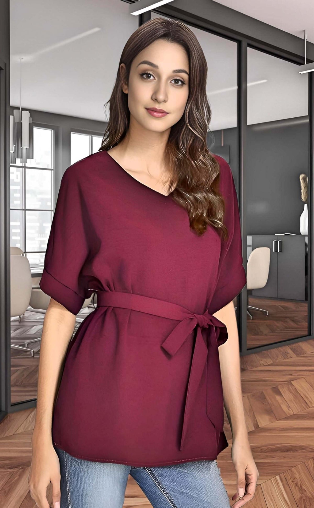 Model wearing a batwing casual blouse in burgundy, perfect for summer styling and everyday wear.