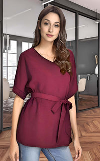 Model wearing a batwing casual blouse in burgundy, perfect for summer styling and everyday wear.