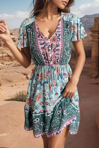 A woman wearing a boho summer mini dress with floral patterns, perfect for casual spring and summer outings.