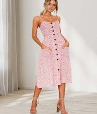 Ditsy floral sundress with buttons and pockets, perfect for casual spring and summer occasions.