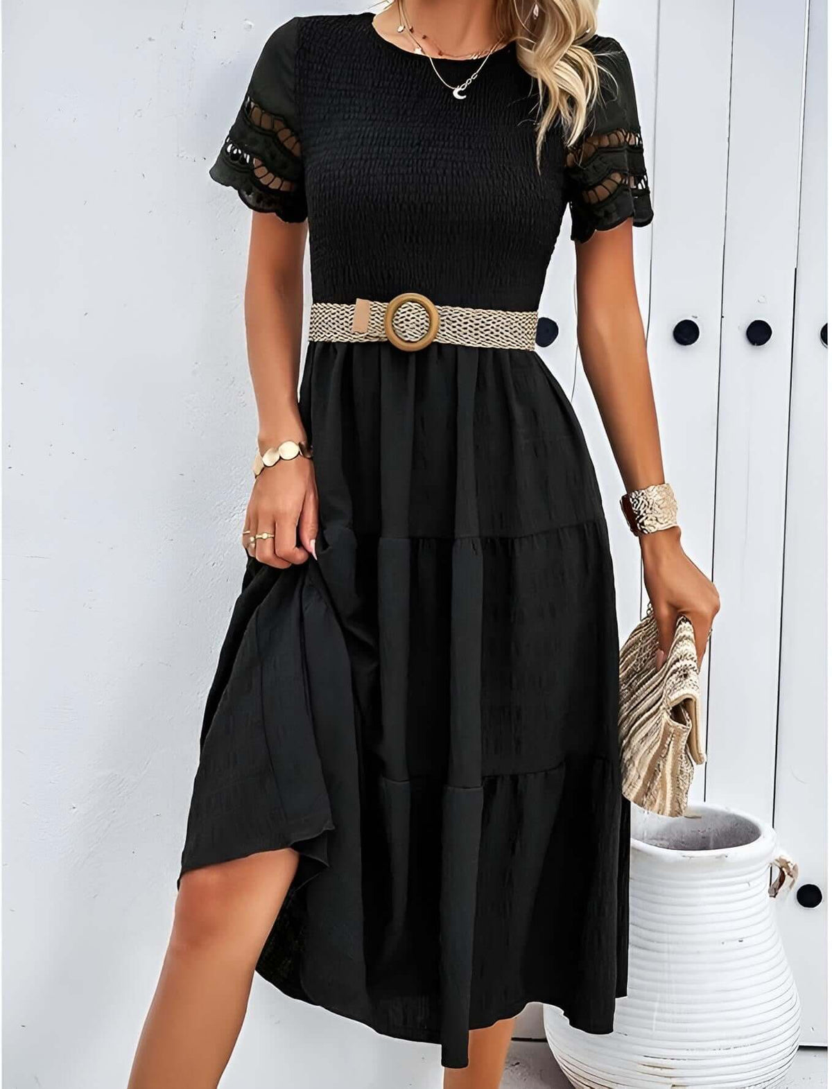Hallow Eyelet Sleeve Dress featuring a shirred top, ruffle hem, and a chic black design.