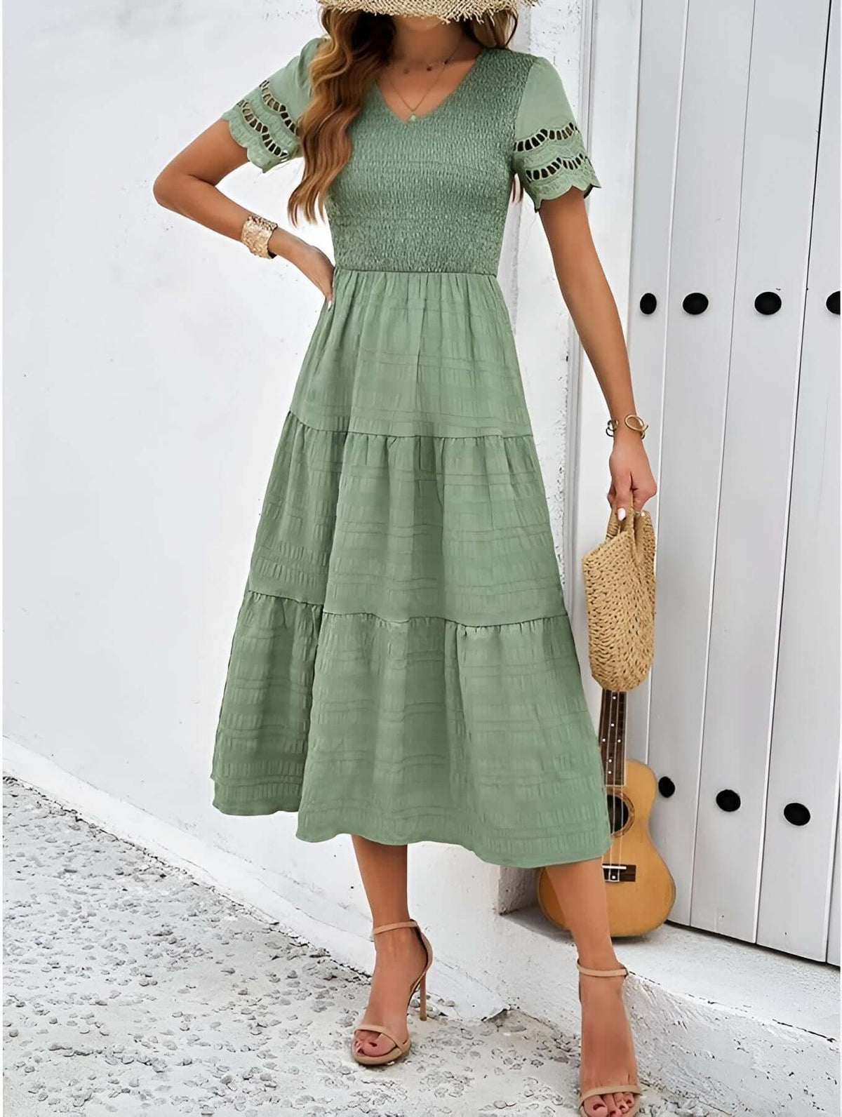 Hallow Eyelet Sleeve Dress in green with ruffle hem and eyelet sleeves, perfect for warm weather outfits.