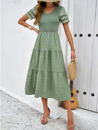 Hallow Eyelet Sleeve Dress in green with ruffle hem and eyelet sleeves, perfect for warm weather outfits.