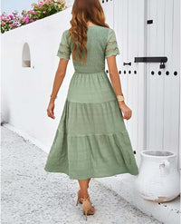Hallow Eyelet Sleeve Dress - Women's boho fashion | Roll Up Fashion, featuring a model wearing a green tiered midi dress.