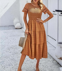 Hallow Eyelet Sleeve Dress - Women's boho fashion | Roll Up Fashion showcasing a model in a tiered midi dress with eyelet sleeves.