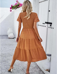 Hallow Eyelet Sleeve Dress - Back view of women’s boho fashion featuring a ruffled tiered hem in solid orange color.