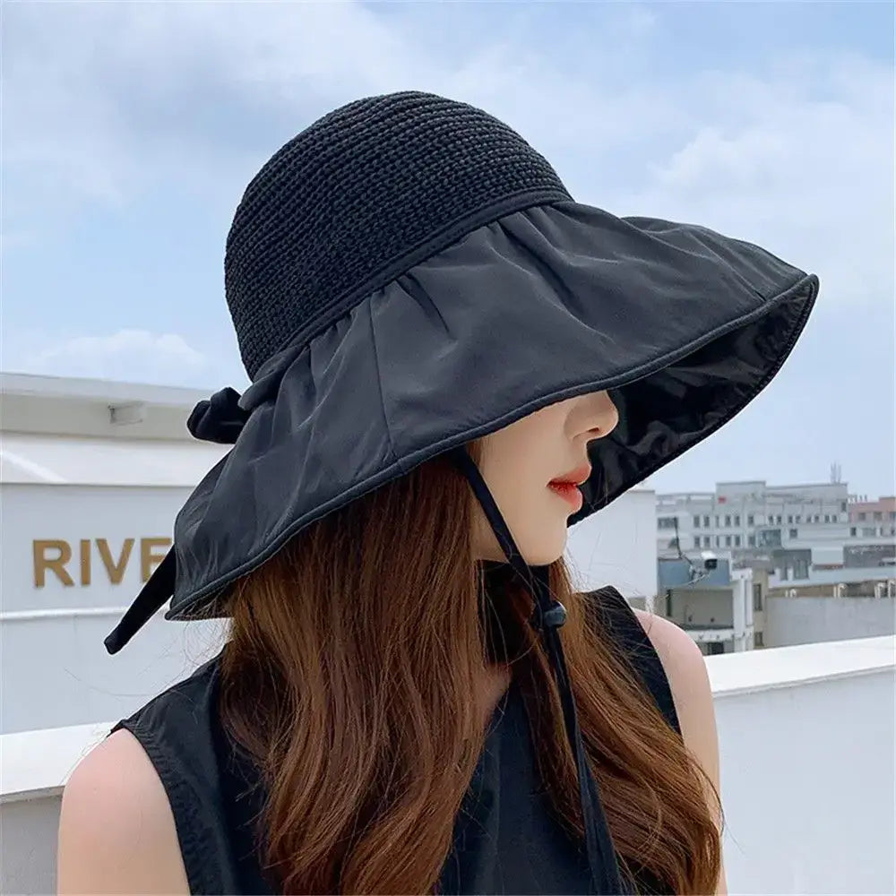 UPF sun protection hat for women with wide brim and decorative bow, perfect for outdoor summer activities.
