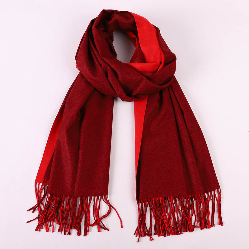Two Tone Cashmere Scarves in red and burgundy with fringed ends, perfect for stylish winter layering.